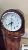 A pair of oak longcase clock cases, one fitted with a Smiths Sectric dial, the other with domed hood