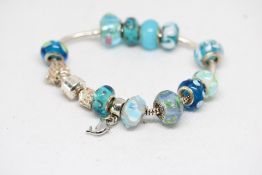 Ladies 925 Silver Pandora Charm Bracelet including 11 Charms variously marked 925 or Pandora.
