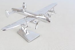 Chrome Lancaster bomber on stand