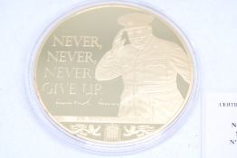Large gold plated coin never never never give up Sir Winston Churchill in pack with coa