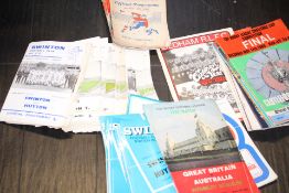 Large collection of unsorted football programs