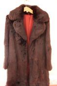 Full-length chocolate brown fur coat