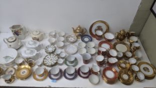 Teaware to include a Royal Standard red and gilt tea set, a Royal Vale part tea service and others