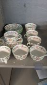 A Minton Haddon Hall part tea service comprising of six cups and saucers, side plates and a sugar