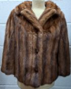A 1960's mid brown mink opera jacket having ¾ sleeves and a 3 button front fastening, approx 36"