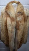 A late 1970's red fox fur jacket having flared sleeves, approx 36" chest. Location:Rail Condition: