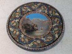 A Swiss Thoune ceramic souvenir Majolic charger, with hand painted lake scene to the centre, 40.