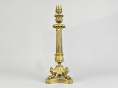 A Brass Table Lamp Base in the Form of a Ribbed Tapering Column on Triform Base with Three Claw