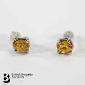 Pair of Oval Platinum and Yellow Sapphire Earrings