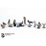 Set of Fourteen Cast Silver Models of Birds