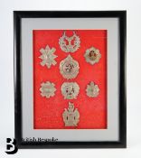 A Collection of Eight Framed Military Cap Badges