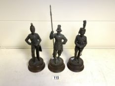 THREE CAST SOLIDERS ON BASES 27CM