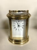 HEAVY OVAL BRASS CARRIAGE CLOCK THE WORKS MARKED 'L' EPEE' 12CM