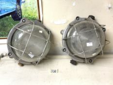 TWO VINTAGE INDUSTRIAL CAST ALUMINIUM BULKHEAD LUMINAIRES / LIGHTS WITH A CAGES AND PRISMATIC