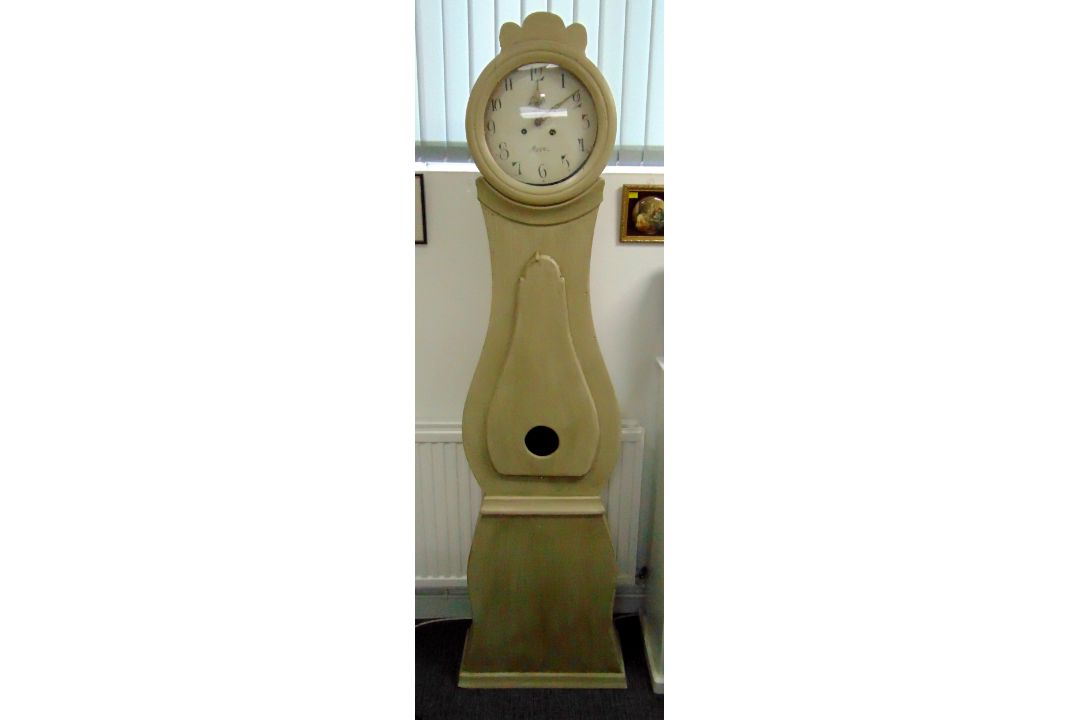 A late 19th century Swedish A S S Mora clock of customary form to include a pendulum and two