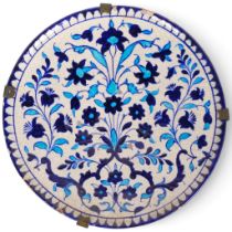A Middle Eastern 19th century blue and white pottery plate, diameter 25cm