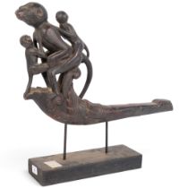 An Antique Burmese carved wood bullock cart shaft, decorated with monkey figures, H47cm, L48cm
