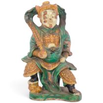 A Chinese Ming Dynasty Sancai glazed pottery figure, H34cm