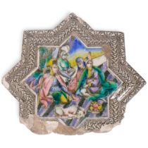 A large Persian Qajar underglaze painted pottery star-shaped tile, W36cm (A/F)