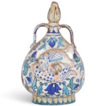 A 19th century Indian Multan pottery 2-handled flask, with relief moulded study of a tiger attacking