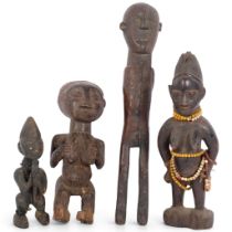 A group of African Tribal fertility figures, including a Yoruba, and Lobi, and a Ere Ibeji