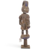 A Yoruba carved wood Tribal fetish figure