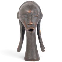 A Fang (Ivory Coast) carved wood ornamental head, early 20th century, H38cm
