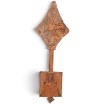 An Ethiopian Orthodox Coptic hand cross, with relief carved decoration, H40cm