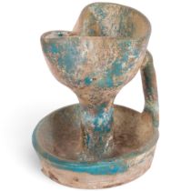 An Ancient Persian pottery spouted oil lamp, circa 13th - 15th century, with iridescent green glaze,