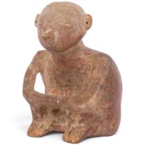 A pre-Colombian (Mexico) Nayarit terracotta flask, in the form of a crouching figure, circa 100 -