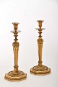 A pair of large candlesticks with octagonal bases