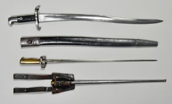 Two Period Bayonets, comprising - one Continental with 21ins bright steel cruciform blade, brass