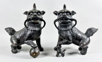 A Large Pair of Chinese Cast Bronze Dogs of Fo, Early 20th Century, the male with right paw