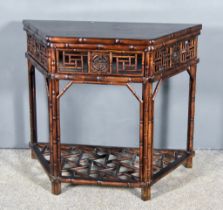 A Chinese Hardwood Console Table, with panelled top, the frieze with fretwork panels, and on