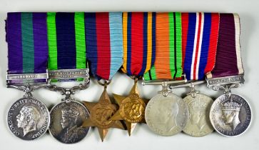 A Mounted Group of Pre-World War II and World War II Medals, comprising - a George V Iraq Medal, the