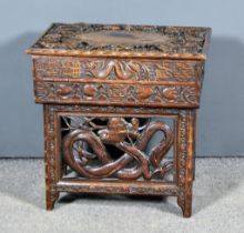 A 19th Century Chinese Hardwood Folding Tea Table, the top carved with stylised dragon and floral