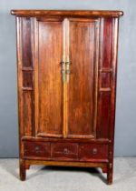 A Chinese Elm Cabinet, fitted shelves and drawers, enclosed by a pair of panelled doors, three small