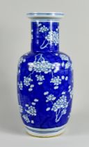 A Chinese Blue and White Porcelain Rouleau Vase, Early 20th Century, painted with prunus blossoms,