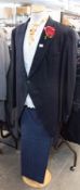 APPROX 20 BLACK TAILCOATS, SIZES 44-50, APPROX 20 BLUE PIN STRIPED TROUSERS, SIZES 38-50 AND