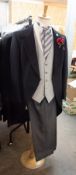 APPROX 30 BLACK TAILCOATS, SIZES 32-48, APPROX 30 GREY PIN STRIPED TROUSERS, SIZES 30-48 AND