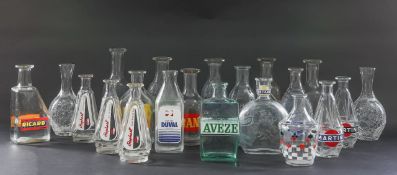 A collection of assorted French glass advertising carafes, early to late 20th century (21)