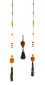 An amber tassel wrap necklace and tassel drop pendant