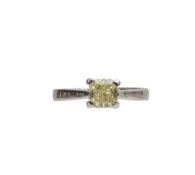 A solitaire light yellow square diamond ring