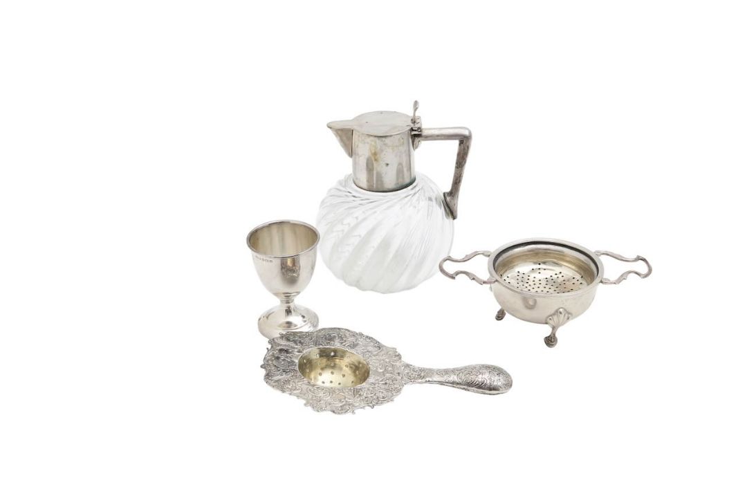 A German silver jug, two tea strainers, and an egg cup - Image 1 of 3