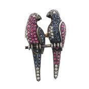 A decorative diamond set parakeet brooch