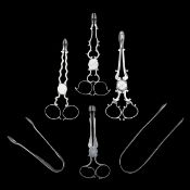 A group of George III and later silver tea and sugar tongs