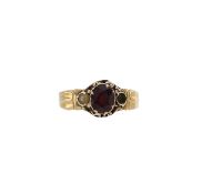 A Victorian garnet and seed pearl dress ring