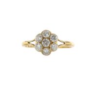 An Edwardian diamond set, daisy cluster ring