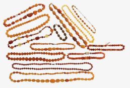 A large collection of amber necklaces