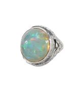 A large opal and diamond dress ring